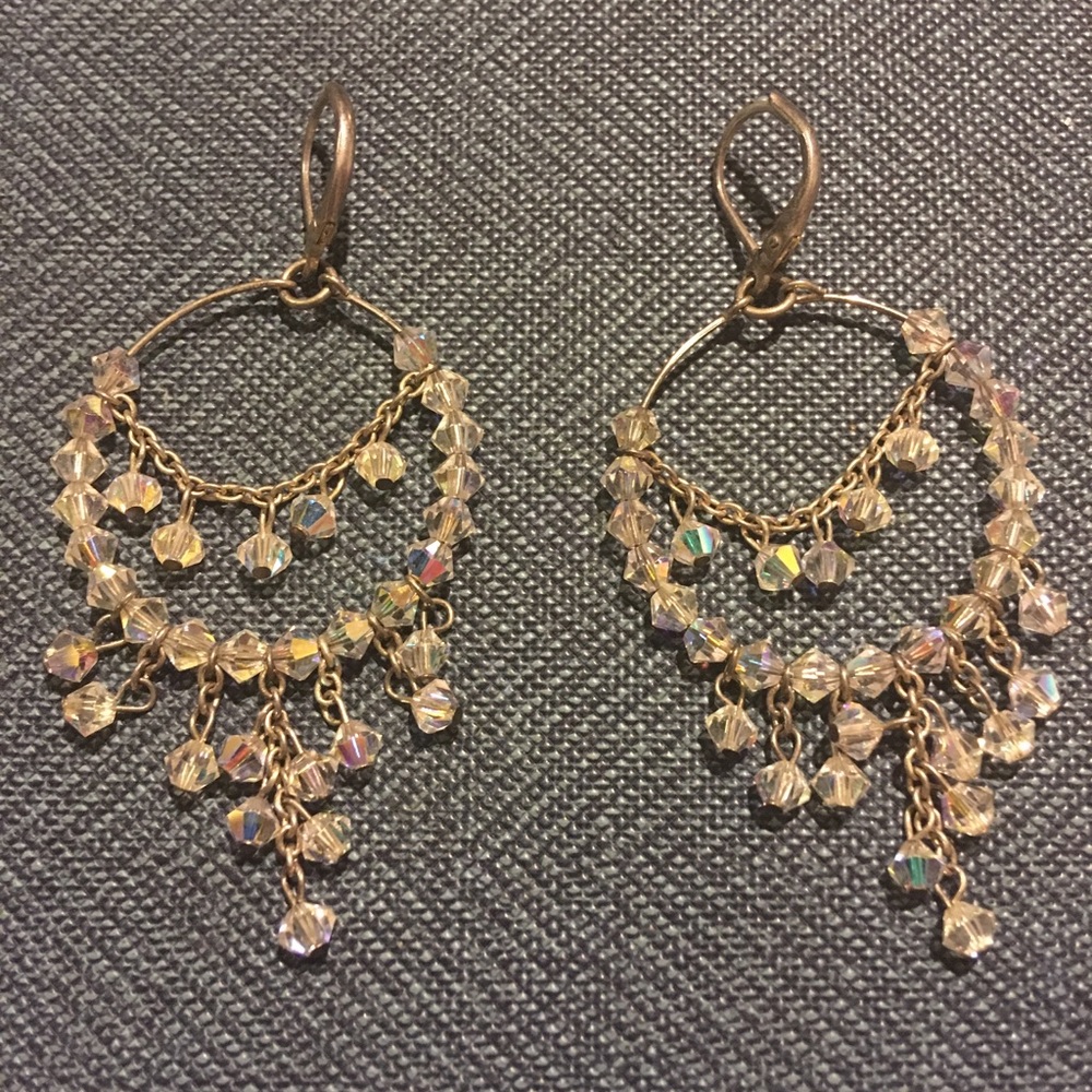 Silver hoop earrings with white dangling beads